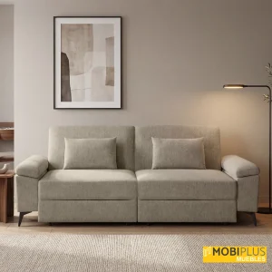 Sofá cama de 3 plazas tapizado en tela beige visón con cojines lumbares y patas metálicas negras, de MobiPlus Muebles.