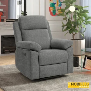 Sillón relax eléctrico gris en rincón de lectura con chimenea y planta de interior, de MobiPlus Muebles.