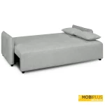 Sofá cama tipo clic-clak desplegado completamente en posición de cama tapizado en tela de color plata.