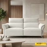 Sofá eléctrico relax modelo Vento de dos plazas con reposacabezas regulables electrónicamente tapizado en tela de color perla en un salón moderno.